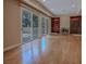 Spacious living room features hardwood floors, a fireplace, and sliding glass doors to the outside at 7969 Bermuda Dunes Ave, Las Vegas, NV 89113