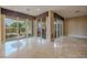 Bright and sunny sunroom with tile floors and multiple glass doors to backyard at 7969 Bermuda Dunes Ave, Las Vegas, NV 89113