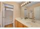 Bathroom with double sinks, decorative mirror, tub, and tile flooring at 8039 Baldy Mountain Ave, Las Vegas, NV 89131