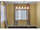 A dining room offers a contemporary lighting fixture and neutral curtains at 8039 Baldy Mountain Ave, Las Vegas, NV 89131
