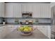 Bright and spacious kitchen with white cabinets, stainless appliances, and center island at 8039 Baldy Mountain Ave, Las Vegas, NV 89131