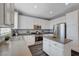 Open kitchen featuring white cabinets, stainless steel appliances, and kitchen island at 8039 Baldy Mountain Ave, Las Vegas, NV 89131