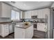 Well-appointed kitchen with white cabinetry, stainless steel appliances, and center island at 8039 Baldy Mountain Ave, Las Vegas, NV 89131
