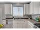 Well-lit kitchen with white cabinetry, stainless steel appliances, and sleek countertops at 8039 Baldy Mountain Ave, Las Vegas, NV 89131