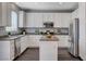Modern kitchen featuring white cabinets, stainless steel appliances, and a functional center island at 8039 Baldy Mountain Ave, Las Vegas, NV 89131