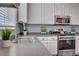 This modern kitchen features stainless steel appliances and white cabinets at 8039 Baldy Mountain Ave, Las Vegas, NV 89131
