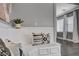 Close up of kitchen nook features custom bench with decorative pillows and a view of the dining area at 8039 Baldy Mountain Ave, Las Vegas, NV 89131
