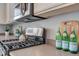 A gas range and microwave complement the kitchen's bright cabinetry and countertops at 8039 Baldy Mountain Ave, Las Vegas, NV 89131