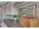 Laundry room with custom cabinets, dark countertops, and wooden decor at 8039 Baldy Mountain Ave, Las Vegas, NV 89131
