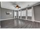 Spacious living room featuring hardwood floors, neutral walls, and a ceiling fan for added comfort at 8039 Baldy Mountain Ave, Las Vegas, NV 89131