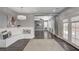 Open concept living space features custom bench seating, hardwood floors, and french doors to backyard at 8039 Baldy Mountain Ave, Las Vegas, NV 89131
