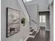 Staircase with modern decor, grey walls, white railing, and wood floors at 8039 Baldy Mountain Ave, Las Vegas, NV 89131