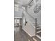 Elegant staircase with wood floors, neutral walls, and contemporary decor, leading to the upper level at 8039 Baldy Mountain Ave, Las Vegas, NV 89131