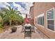 Spacious outdoor dining area, fire pit and lush tropical landscaping at 8222 Sorrel St, Las Vegas, NV 89139