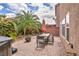 Inviting backyard with dining area, fire pit, and privacy landscaping at 8222 Sorrel St, Las Vegas, NV 89139