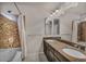 Stylish bathroom featuring double vanity, soaking tub, and updated fixtures at 8222 Sorrel St, Las Vegas, NV 89139