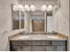 Bathroom boasts double sinks, granite countertops, large mirror, and bathtub-shower combo at 8222 Sorrel St, Las Vegas, NV 89139