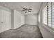 Bedroom showcases plush carpeting, neutral paint, ceiling fan, and shuttered windows at 8222 Sorrel St, Las Vegas, NV 89139
