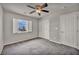 Bedroom features neutral walls, gray carpet, shuttered windows, and ceiling fan at 8222 Sorrel St, Las Vegas, NV 89139
