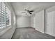 Comfortable bedroom features gray carpet, ceiling fan, and window with shutters at 8222 Sorrel St, Las Vegas, NV 89139
