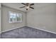 Bedroom featuring plush carpet, window with shutter, and ceiling fan at 8222 Sorrel St, Las Vegas, NV 89139