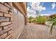 Spacious two car garage and custom brick paver driveway with lush landscaping at 8222 Sorrel St, Las Vegas, NV 89139