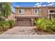 Attractive home with a two-car garage, brick driveway, and manicured landscaping at 8222 Sorrel St, Las Vegas, NV 89139