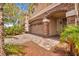 Home featuring attached garage, stone accents, and custom brick paver driveway at 8222 Sorrel St, Las Vegas, NV 89139