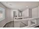 A hallway with wood-look floors and white walls leads to bedrooms and baths at 8222 Sorrel St, Las Vegas, NV 89139