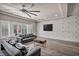 Bright living room with plantation shutters, hardwood floors, and contemporary ceiling fan at 8222 Sorrel St, Las Vegas, NV 89139