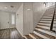 Staircase with wood-style flooring and bright white walls, leading to the upper level at 8222 Sorrel St, Las Vegas, NV 89139