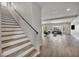 Staircase connects the levels, offering views of the living area and an abundance of natural light at 8222 Sorrel St, Las Vegas, NV 89139