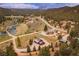 Expansive aerial view of wooded community, showcasing homes and winding roads at 855 E Ponderosa Rd, Mammoth Creek, UT 84735