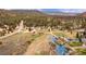 Beautiful aerial view of a property with a stream, surrounded by lush trees and scenic mountain views at 855 E Ponderosa Rd, Mammoth Creek, UT 84735