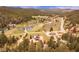 Great aerial view showcasing a charming home surrounded by lush greenery at 855 E Ponderosa Rd, Mammoth Creek, UT 84735