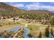 Scenic aerial view of the neighborhood with lush trees and a beautiful river at 855 E Ponderosa Rd, Mammoth Creek, UT 84735