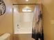 Clean bathroom showcasing a tub-shower with neutral walls and decorative shower curtain at 855 E Ponderosa Rd, Mammoth Creek, UT 84735