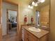 Neutral colored bathroom featuring a wood vanity with lots of storage space and wood floor at 855 E Ponderosa Rd, Mammoth Creek, UT 84735