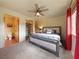 Bedroom with neutral colors, red accents, ceiling fan and lots of natural light at 855 E Ponderosa Rd, Mammoth Creek, UT 84735