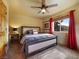 Bedroom with neutral colors, red accents and lots of natural light and closet at 855 E Ponderosa Rd, Mammoth Creek, UT 84735