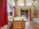 Dining room featuring rustic wood table and red accents with beautiful views of the surrounding woods at 855 E Ponderosa Rd, Mammoth Creek, UT 84735
