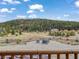 Scenic backyard view with an outdoor seating area and mature trees at 855 E Ponderosa Rd, Mammoth Creek, UT 84735