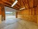 Spacious one-car garage interior with overhead lighting at 855 E Ponderosa Rd, Mammoth Creek, UT 84735