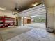 Open garage interior with ladder and storage space plus a peek to the outside at 855 E Ponderosa Rd, Mammoth Creek, UT 84735