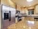 Well-lit kitchen featuring stainless steel appliances, light wood cabinets and beautiful granite counter tops at 855 E Ponderosa Rd, Mammoth Creek, UT 84735