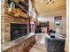 Attractive living room featuring a stone fireplace and vaulted ceilings at 855 E Ponderosa Rd, Mammoth Creek, UT 84735