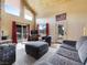 Cozy living room featuring vaulted ceilings, stone fireplace, and mountain views at 855 E Ponderosa Rd, Mammoth Creek, UT 84735