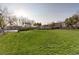 Wide shot of common community park featuring grass lawn, trees, picnic benches, and walking paths at 9100 Balcony Trellis Ave, Las Vegas, NV 89149