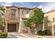 Charming two-story home with a well-maintained lawn and a private two car garage at 9100 Balcony Trellis Ave, Las Vegas, NV 89149