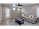 Inviting living room with stylish rug, ceiling fan, and comfortable seating arrangement perfect for relaxation at 9100 Balcony Trellis Ave, Las Vegas, NV 89149
